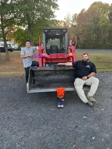gmtp employees next to a tractor WAITING FOR trunk or treat to start.