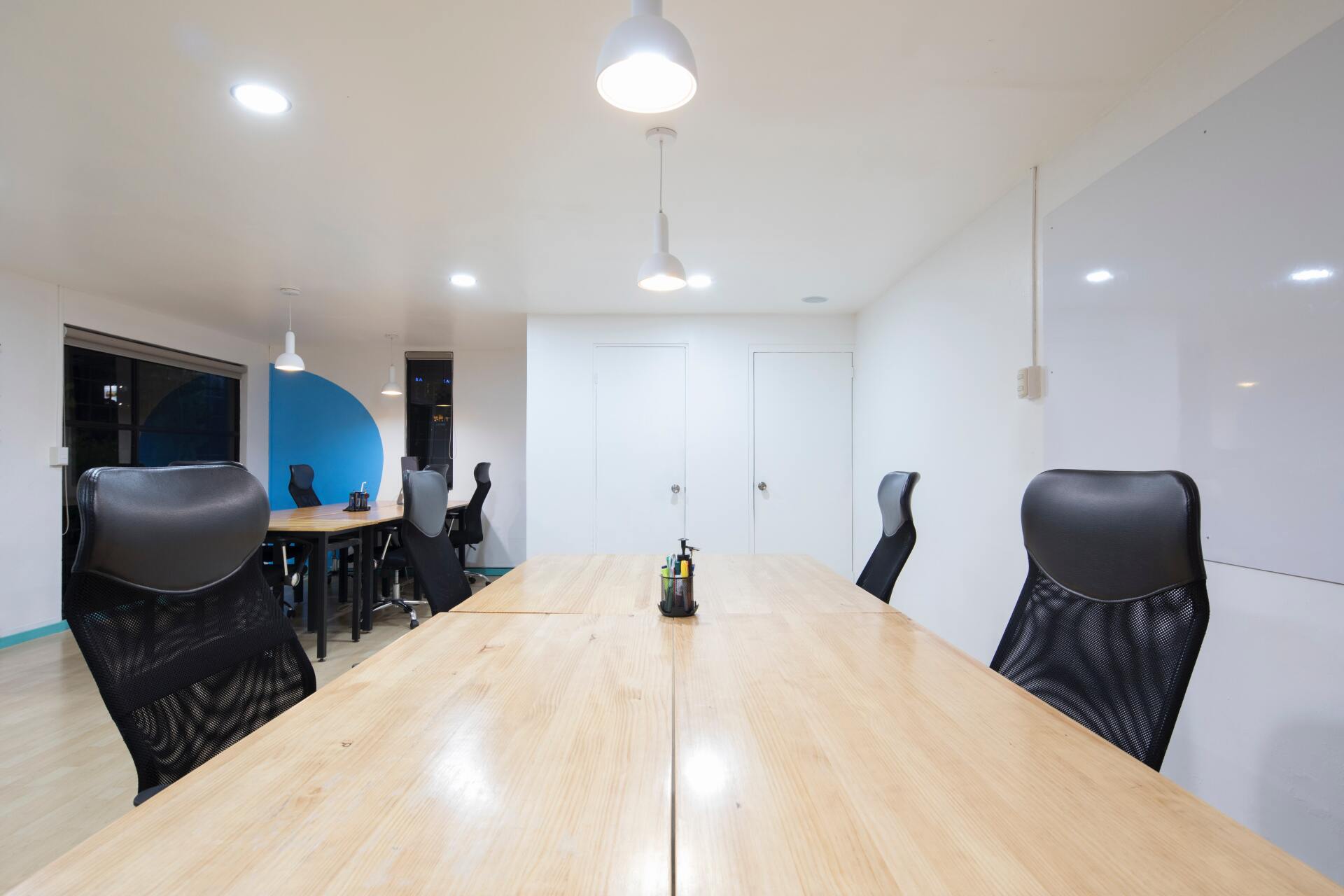 Picture commercial office canteen space that has been painted in light grey by painters and decorators Derby