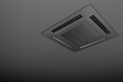 A charcoal-grey ceiling cassette air conditioning unit mounted against a gradient grey background.