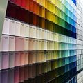 Rows of color swatches arranged in a rainbow gradient on display shelves