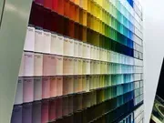 Paint swatches arranged in rows, showing a wide spectrum of colors from warm to cool tones.