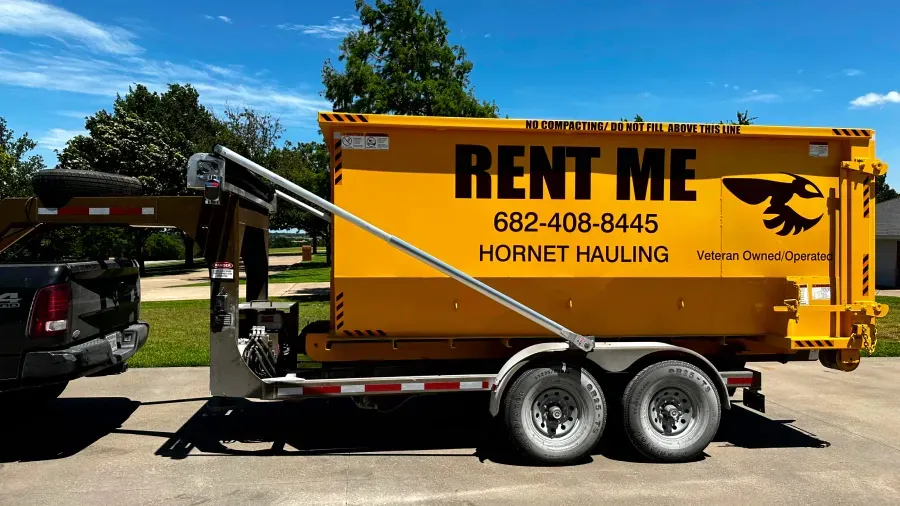 A yellow dumpster with the word rent me on it
