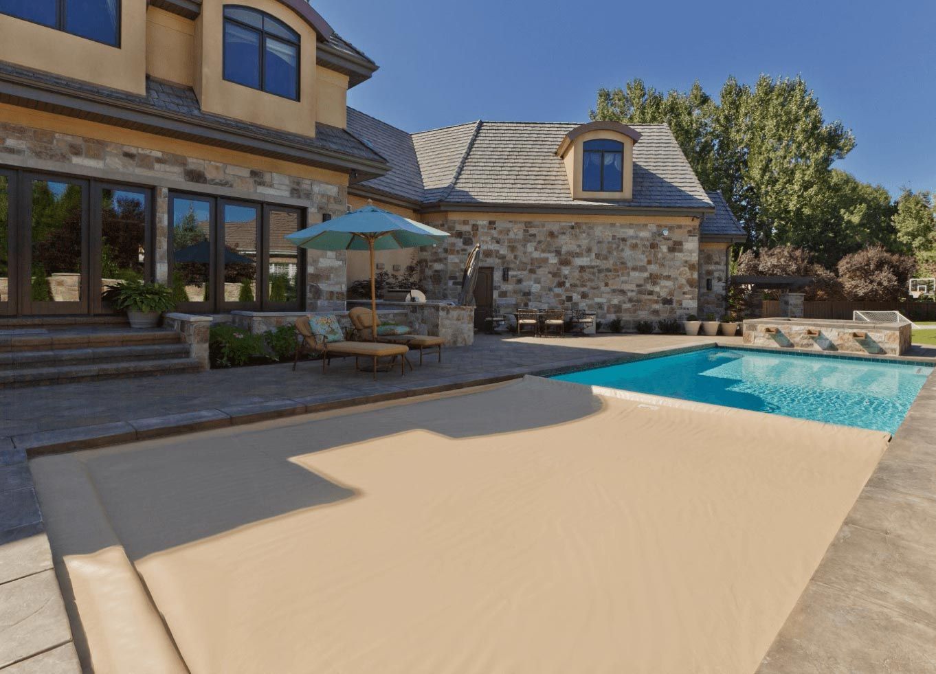 a tan pool cover that automatically deploys