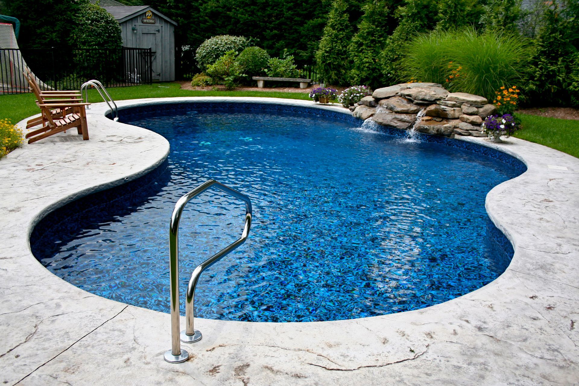 a large swimming pool with a staircase leading to it