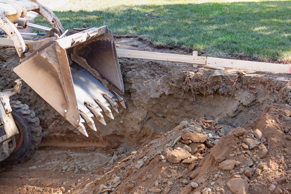A bulldozer is digging a hole in the ground.