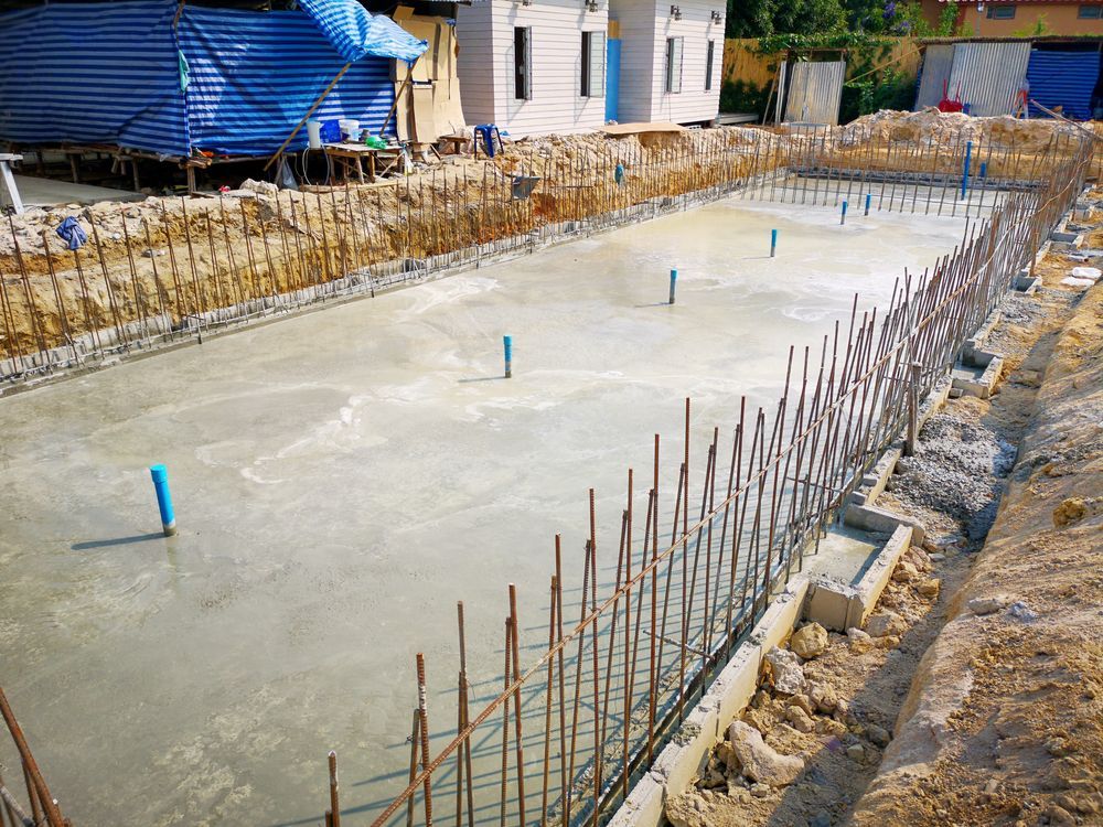 A swimming pool is being built in a construction site.