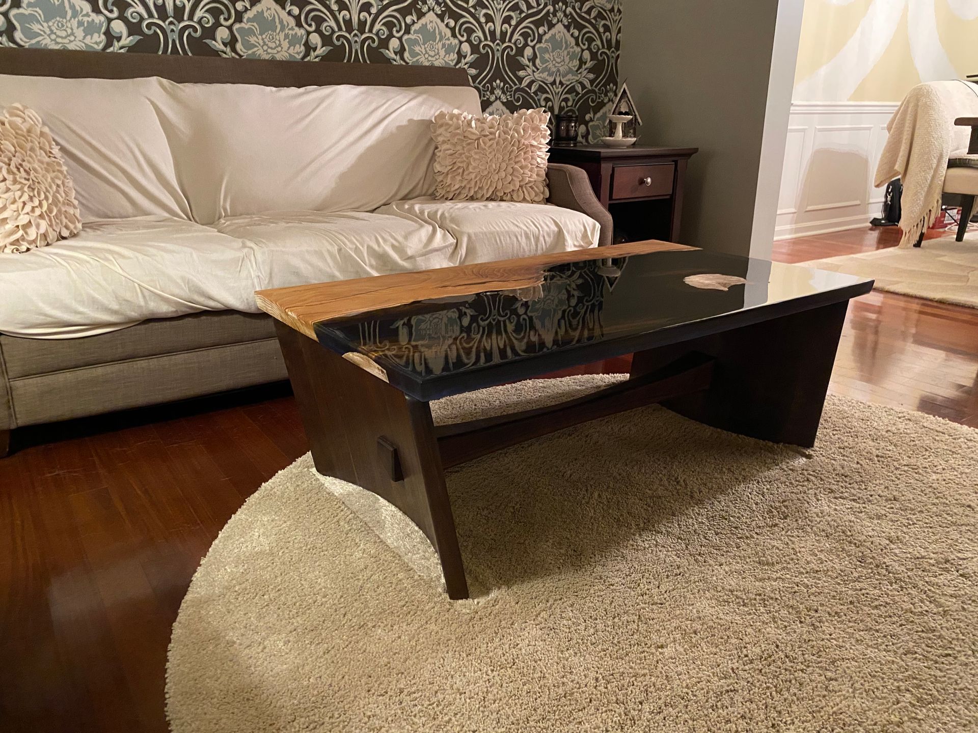 A living room with a couch and a coffee table