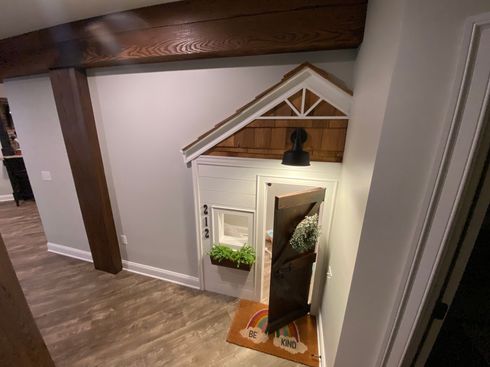 there is a playhouse in the corner of the room . there is a playhouse in the corner of the room .