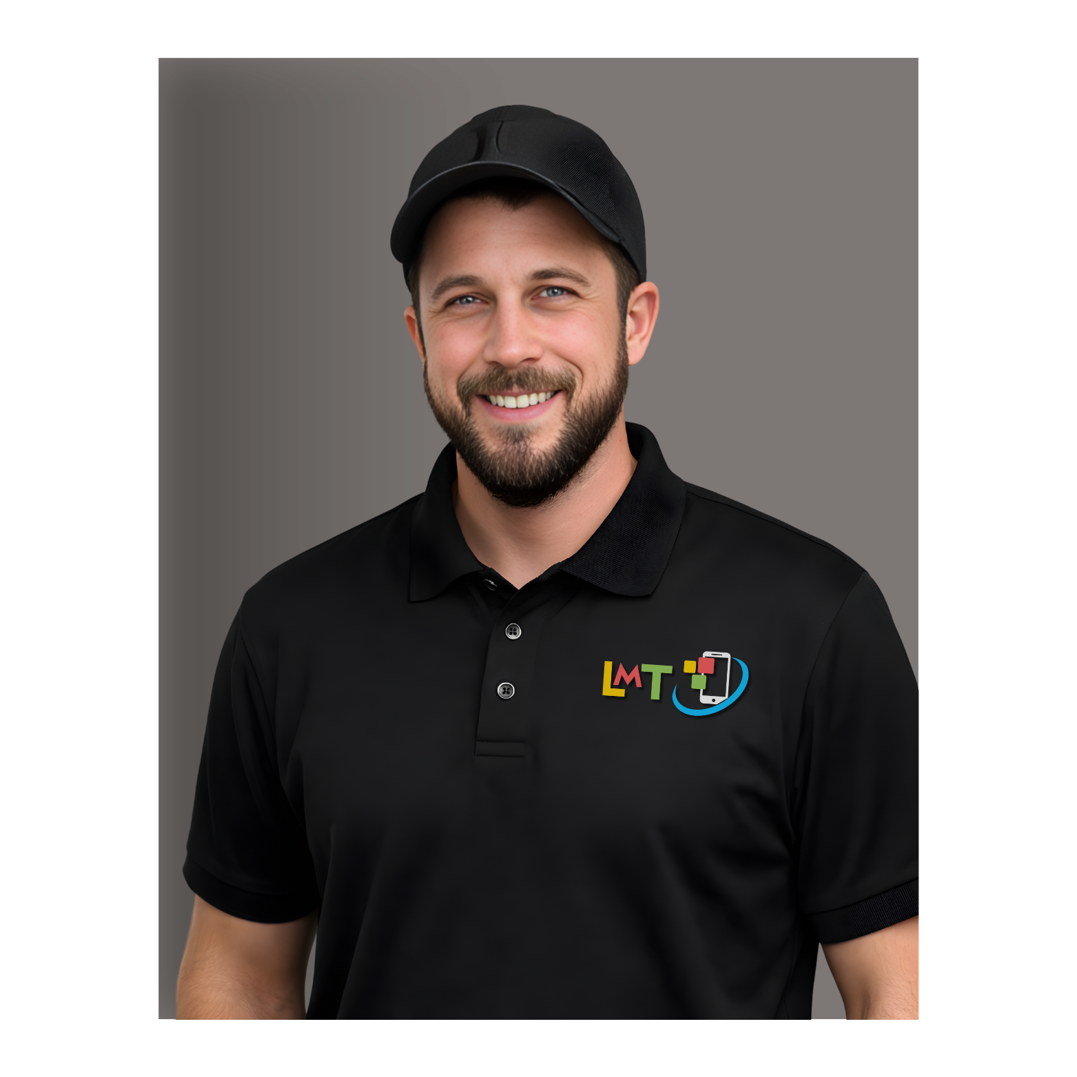 A smiling man with a beard, wearing a black cap and polo shirt with 