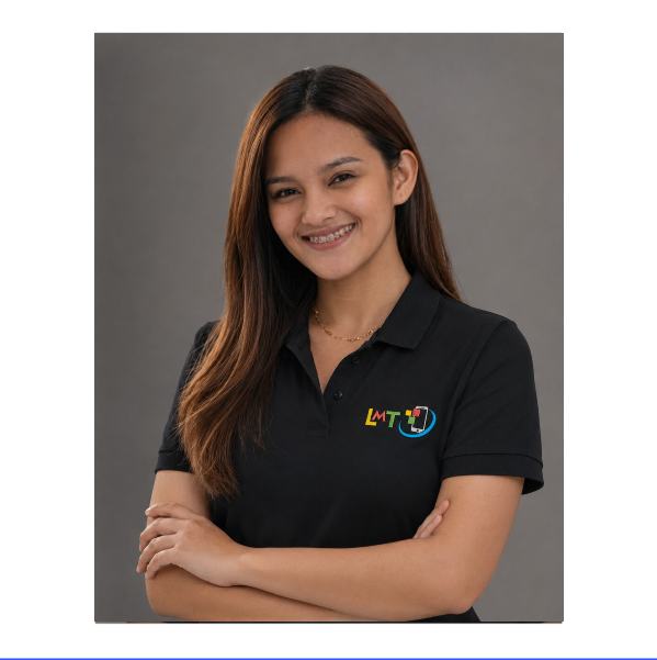 A woman with long brown hair and a black polo shirt smiles. She is in front of a dark background.
