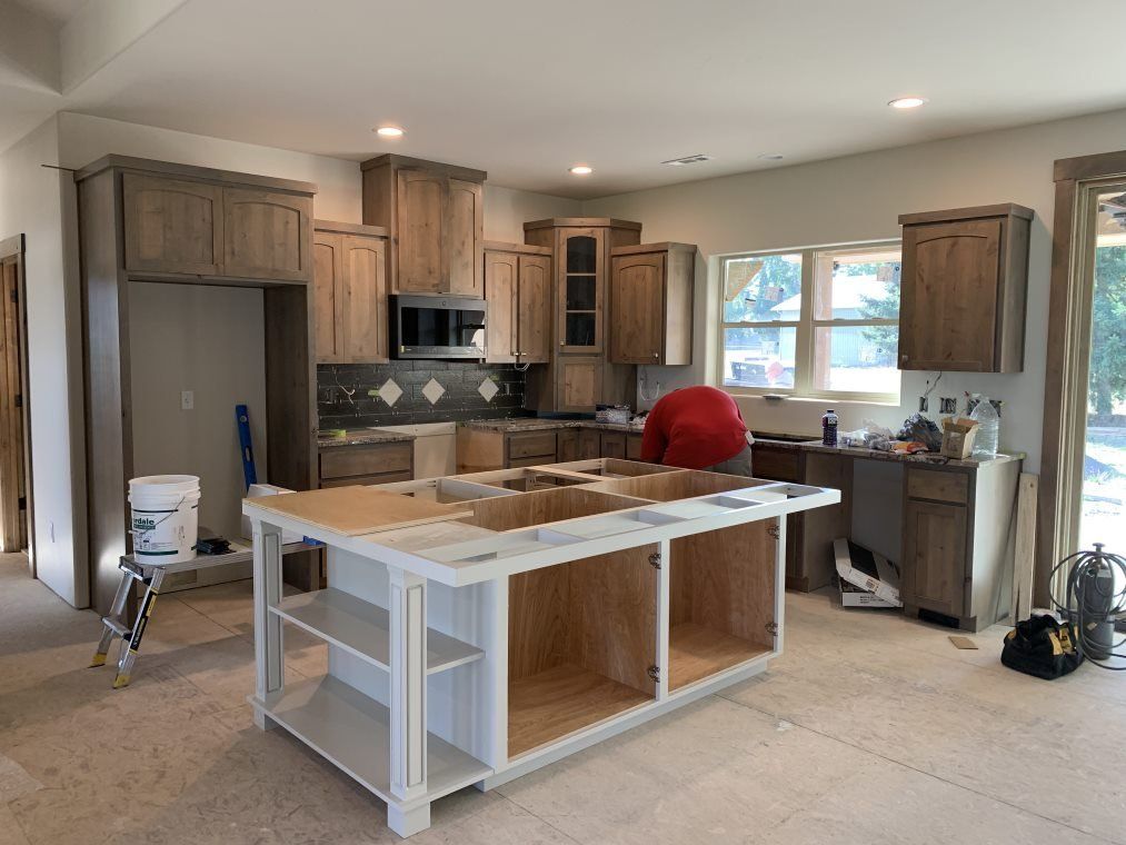 Installing New Countertop — Medford, OR — Gary Smith Custom Cabinet Shop