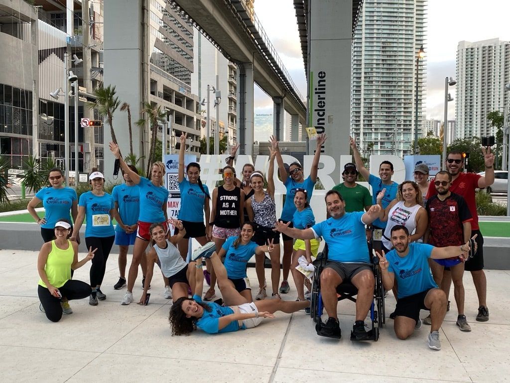 A group of people are posing for a picture in front of a building.