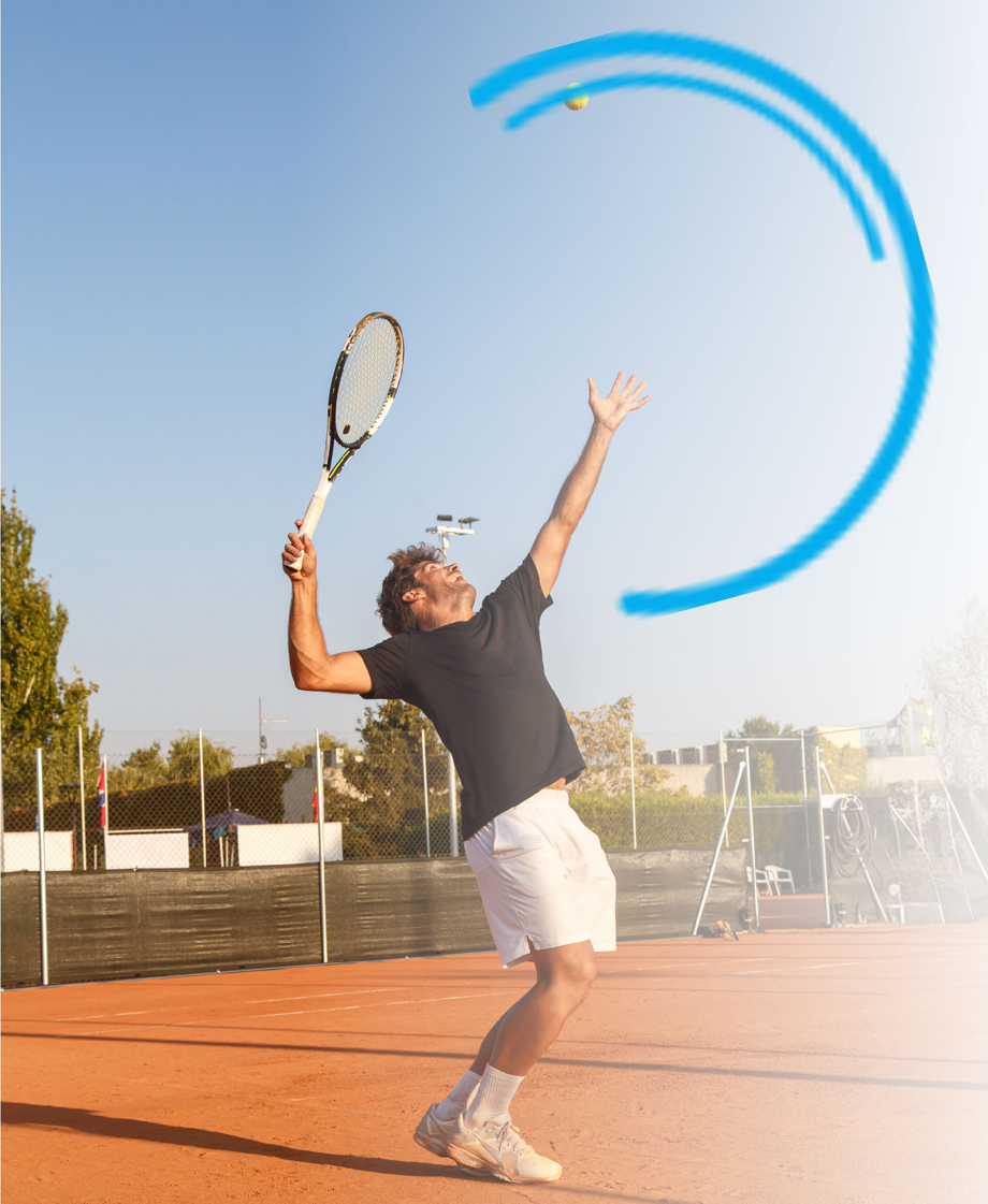 Tennis player serving on clay court, ball in air, racket raised. Blue arc graphic.