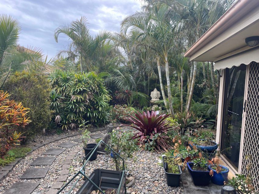 A House With a Lot of Potted Plants in Front of It — Greener Gardens Gardening Service In Thrumster, NSW