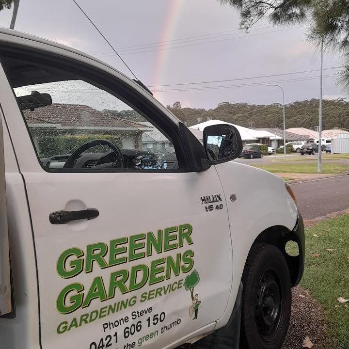 A Greener Gardens Truck is Parked on the Side of the Road — Greener Gardens Gardening Service In Thrumster, NSW