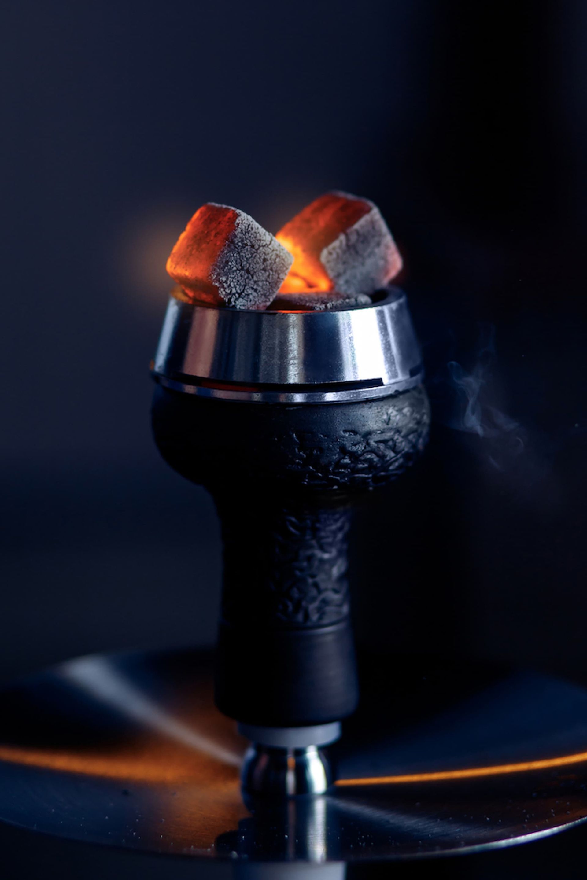 A Hookah with Charcoal in It Is Sitting on A Table — Mini Market Townsville Smoke Shop
