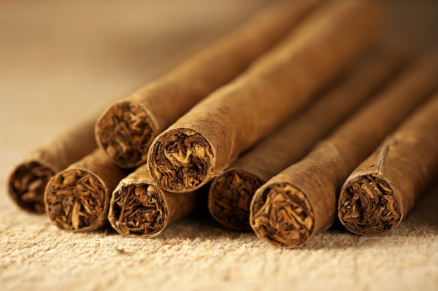 A Bunch of Cigars Are Stacked on Top of Each Other on A Table — Mini Market Townsville Smoke Shop in Townsville City, QLD