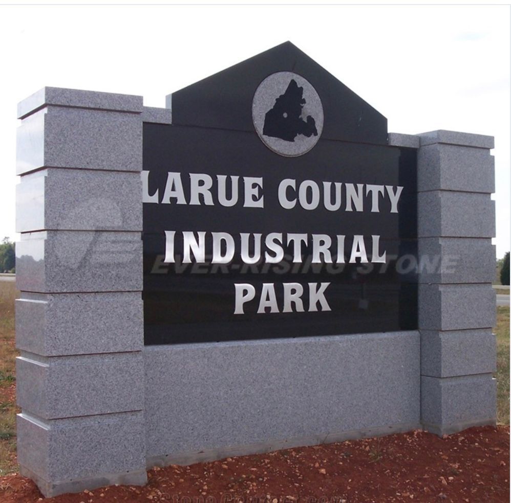 Larue County Industrial Park sign in black and gray stone monument sign