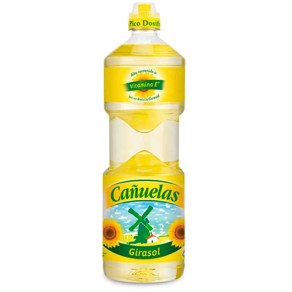 Botella de aceite de girasol Cañuelas, etiqueta amarilla, con ilustración de girasol y molino de viento.