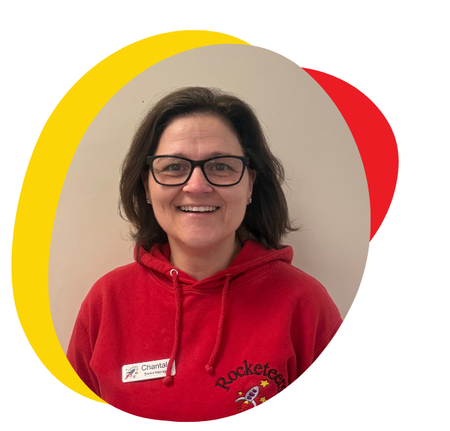 A woman wearing a red hoodie is smiling for the camera.