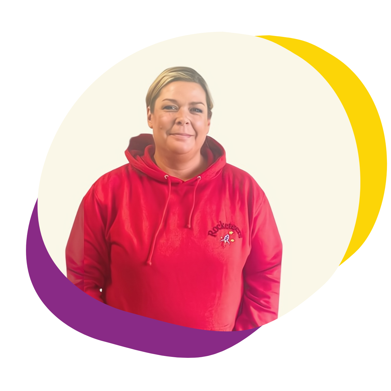 A woman in a red hoodie is standing in a purple and yellow circle.