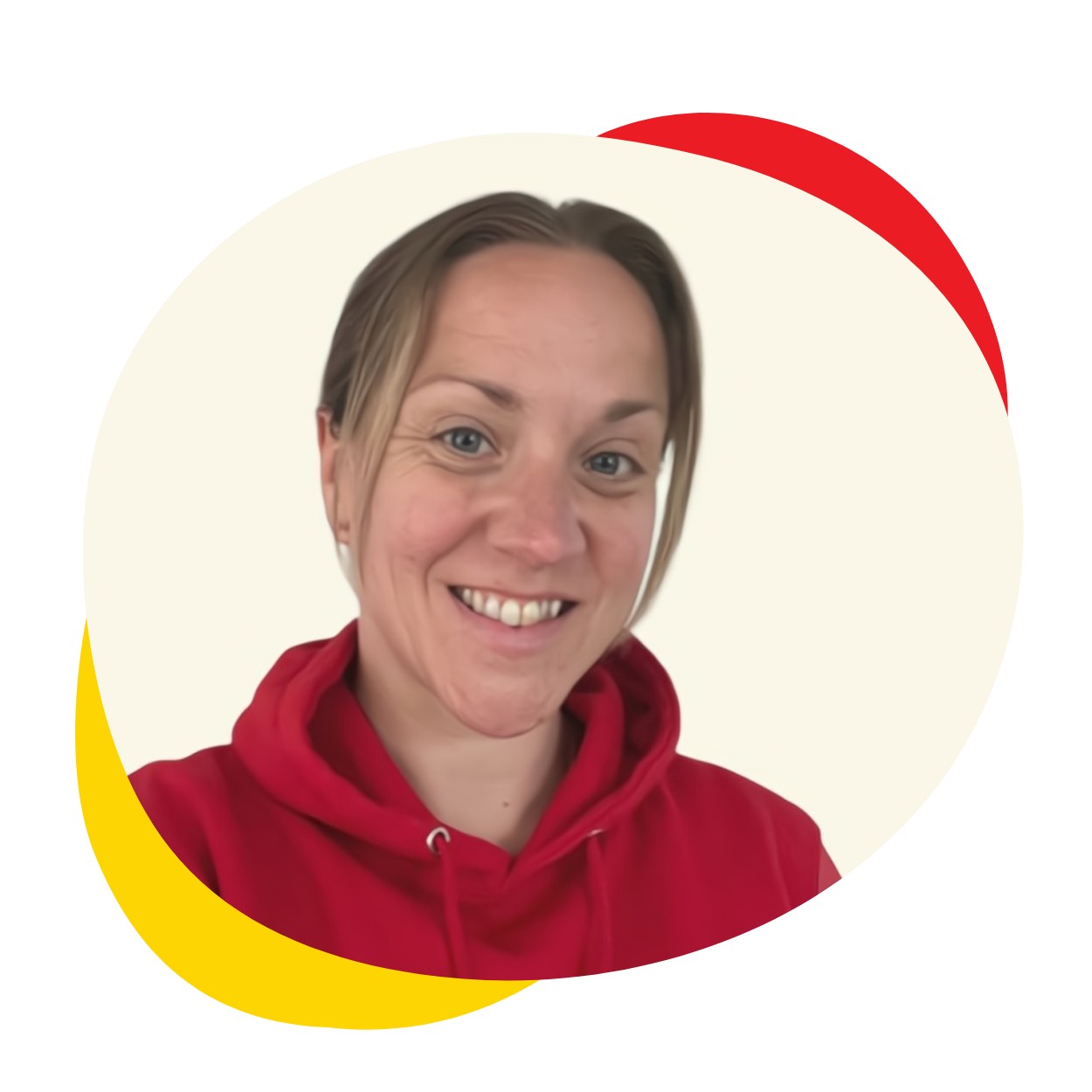 A woman wearing a red hoodie is smiling for the camera.
