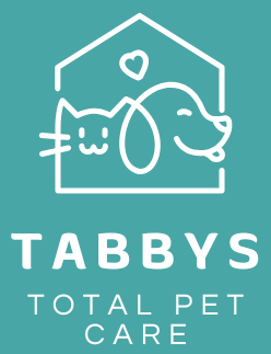A logo for tabbys total pet care with a dog and a cat in a house. Naples, FL