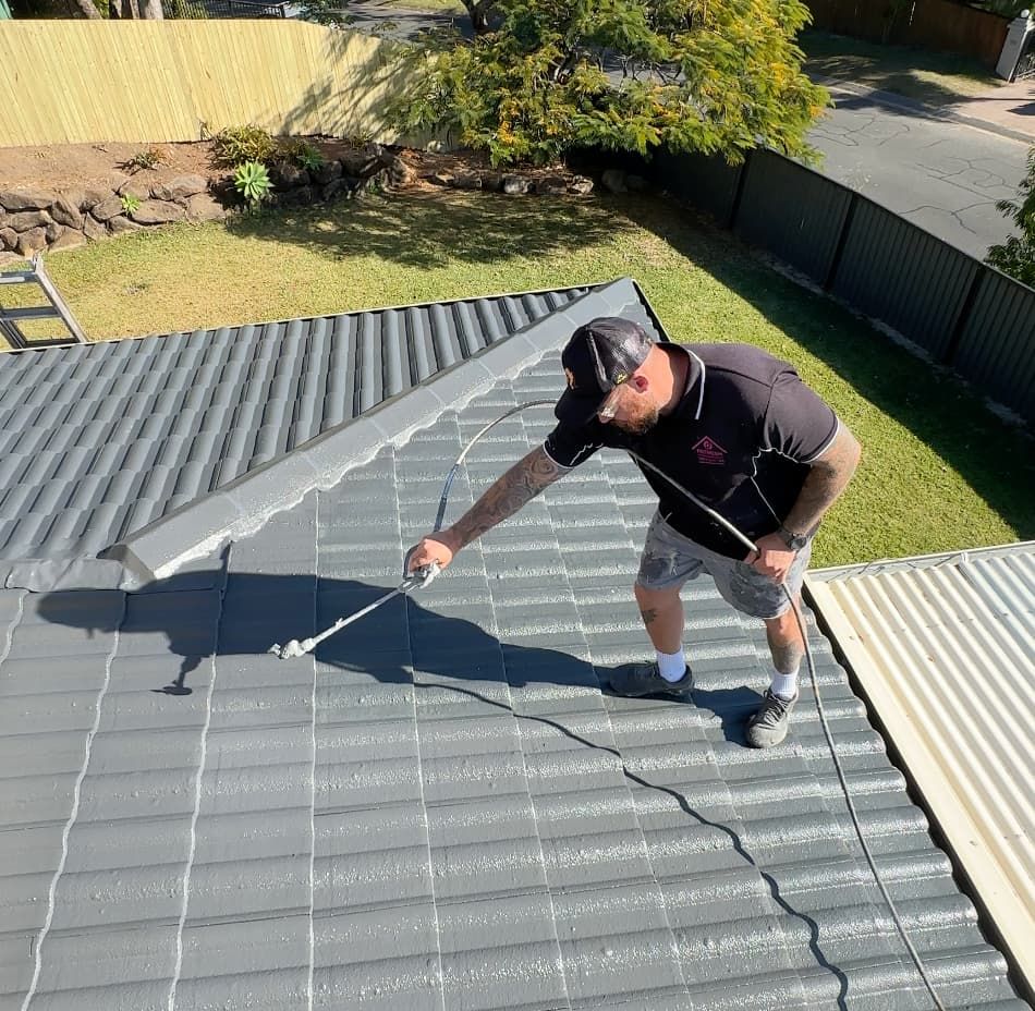 Reece from Refresh painting a roof in Palm Beach QLD