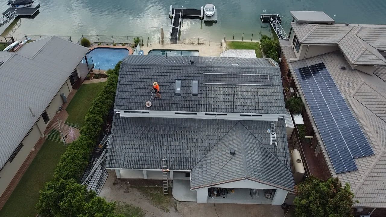 A drone shot of someone restoring a roof in Palm Beach QLD