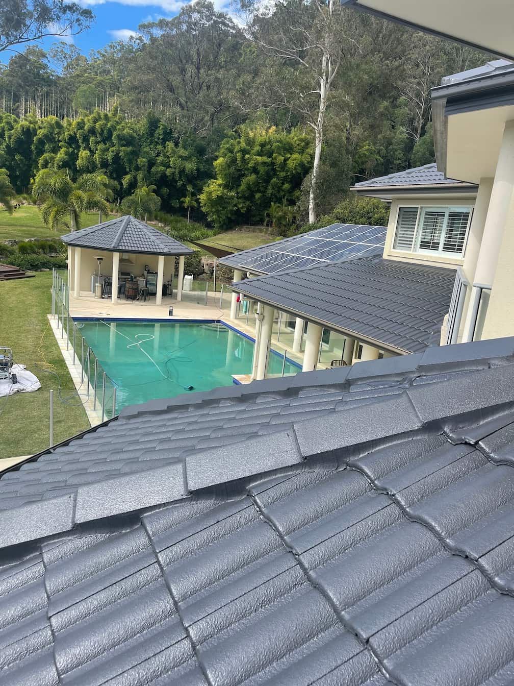 A large house with a swimming pool in the backyard.