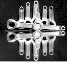 A black and white photo of a bunch of metal parts