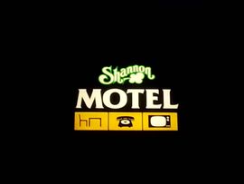 Logo for Shannon Motel: green shamrock above 