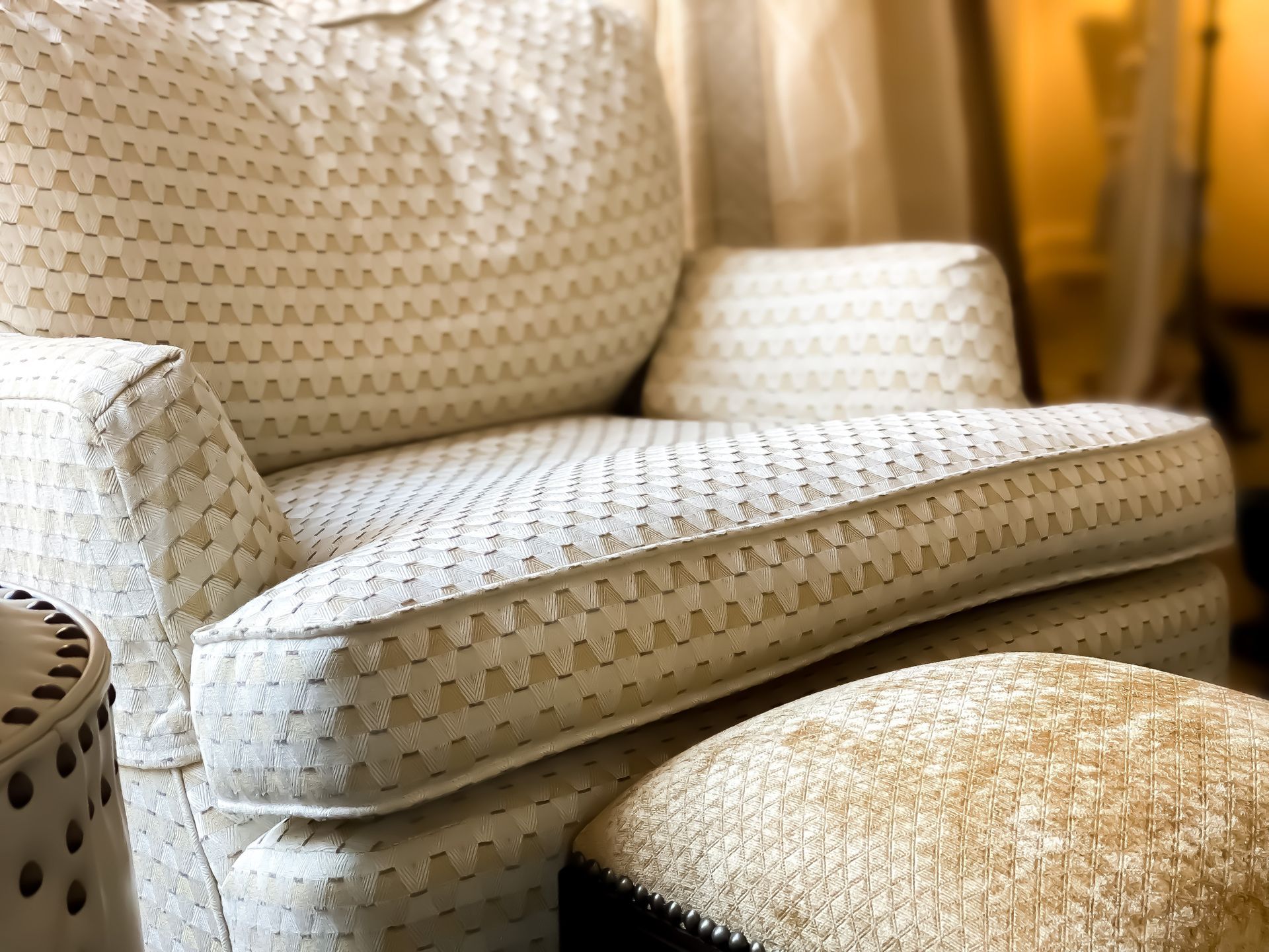 A white chair and ottoman in a living room