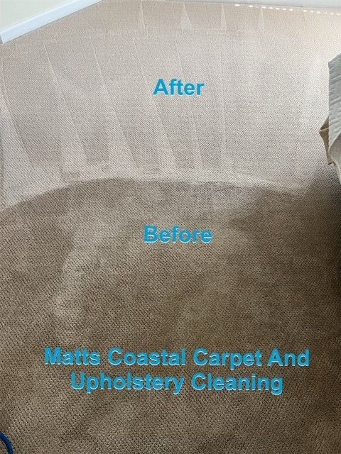 A vacuum cleaner is sitting on a dirty carpet in a living room.