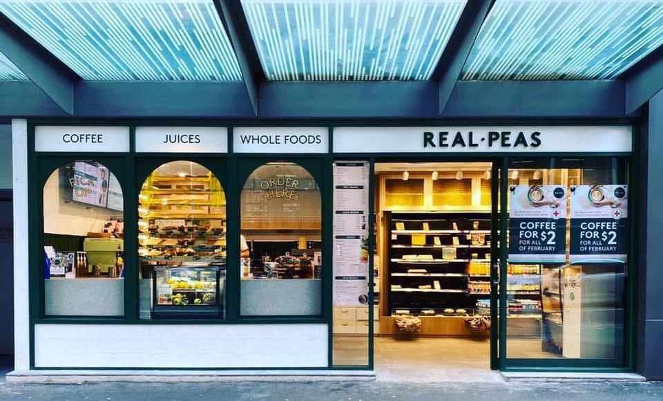 A Store Front With a Sign That Says