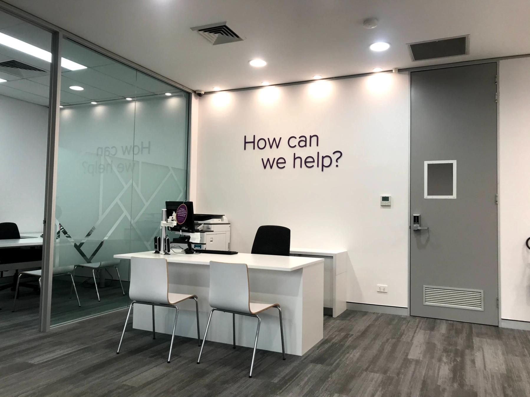 There is a Sign on the Wall That Says How Can We Help — Nyon Shopfitters in Morisset, NSW