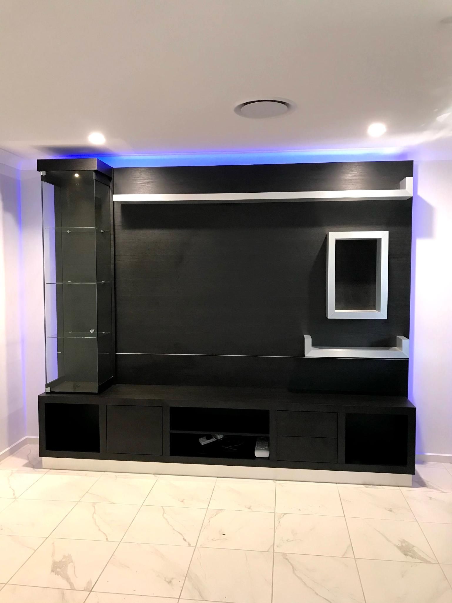 An Empty Room With a Black Entertainment Center — Nyon Shopfitters in Morisset, NSW