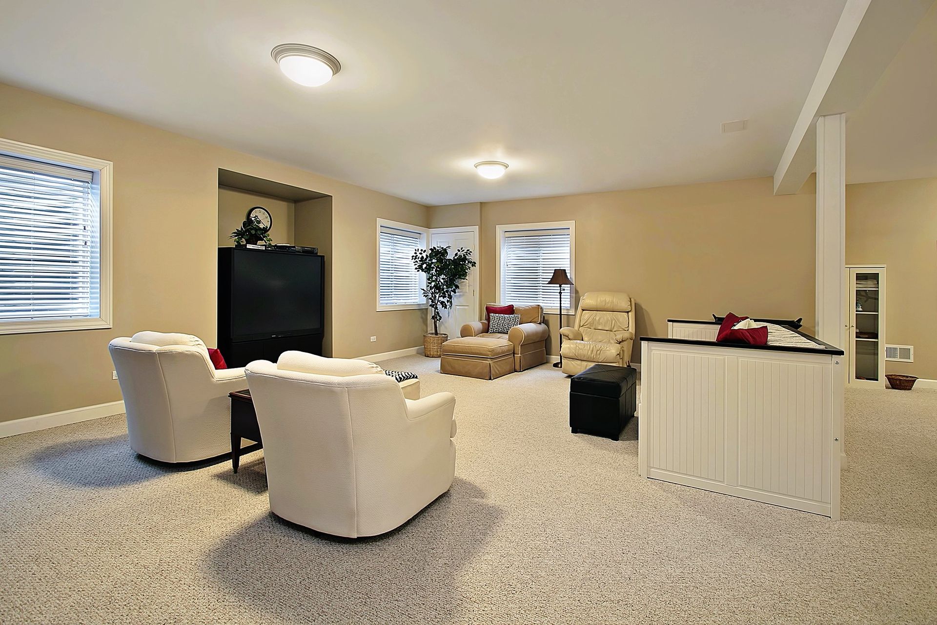 A cozy finished basement with tan walls