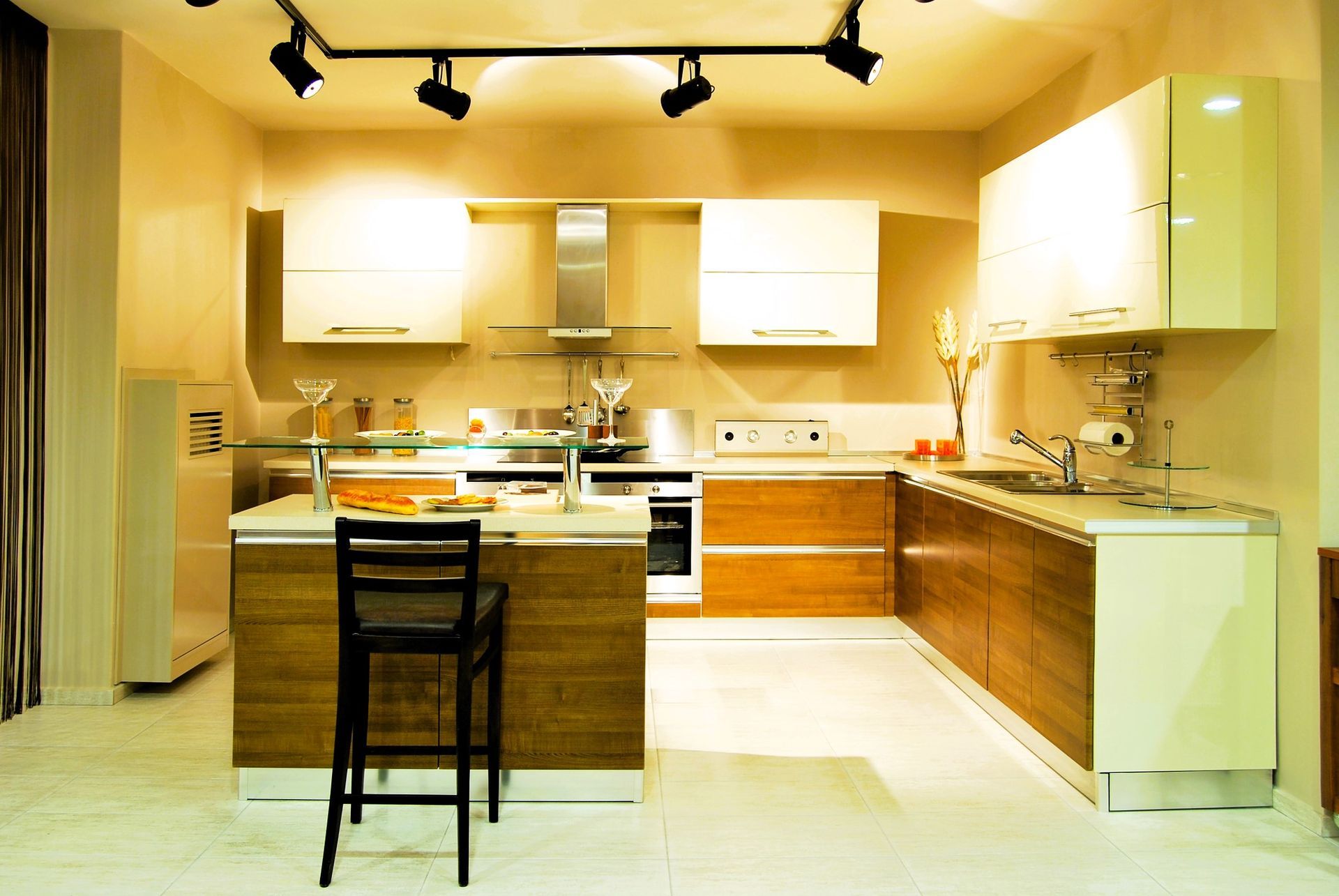 Modern basement kitchenette with wooden cabinets and a central island, designed for functionality and style