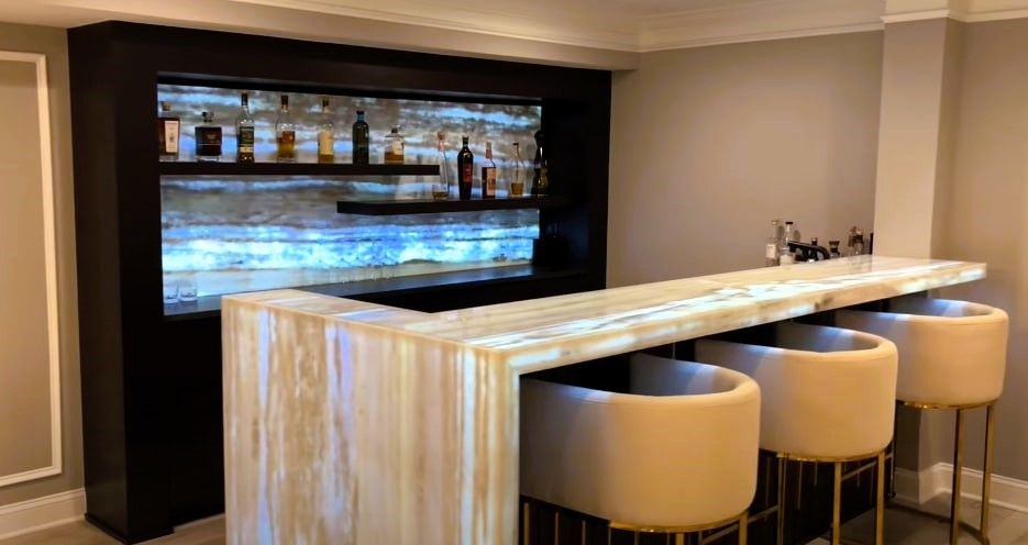 Stylish basement bar with creative lighting.