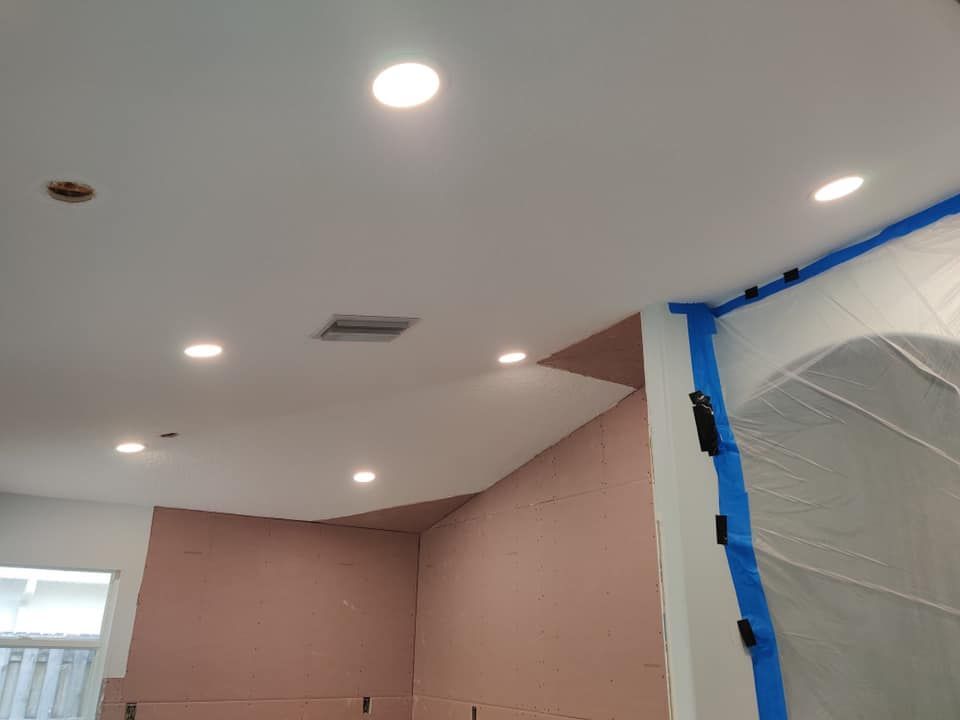 a room with a ceiling that is being painted