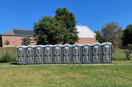 Line of portable toilets in Farmington, NH