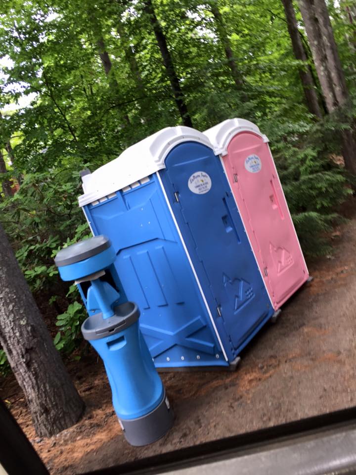 Pair of portable toilets and a handwashing station