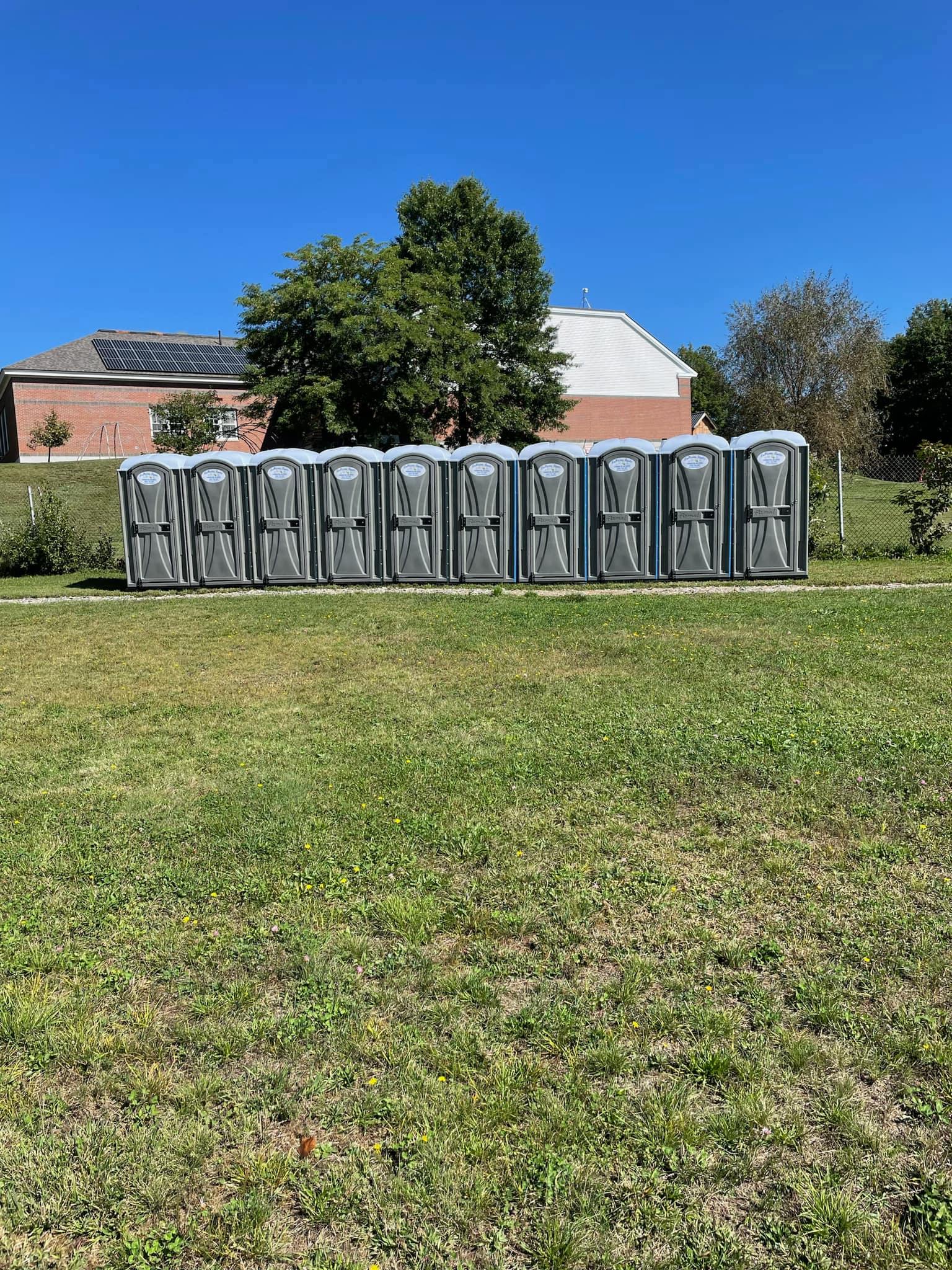 Line of Portable toilets in Rochester, NH