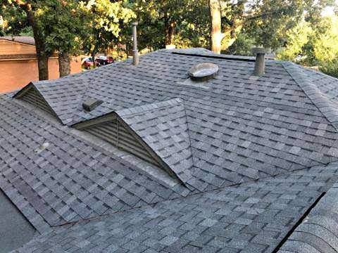 A rooftop with waterproof shingles, illustrating roof waterproofing protection.