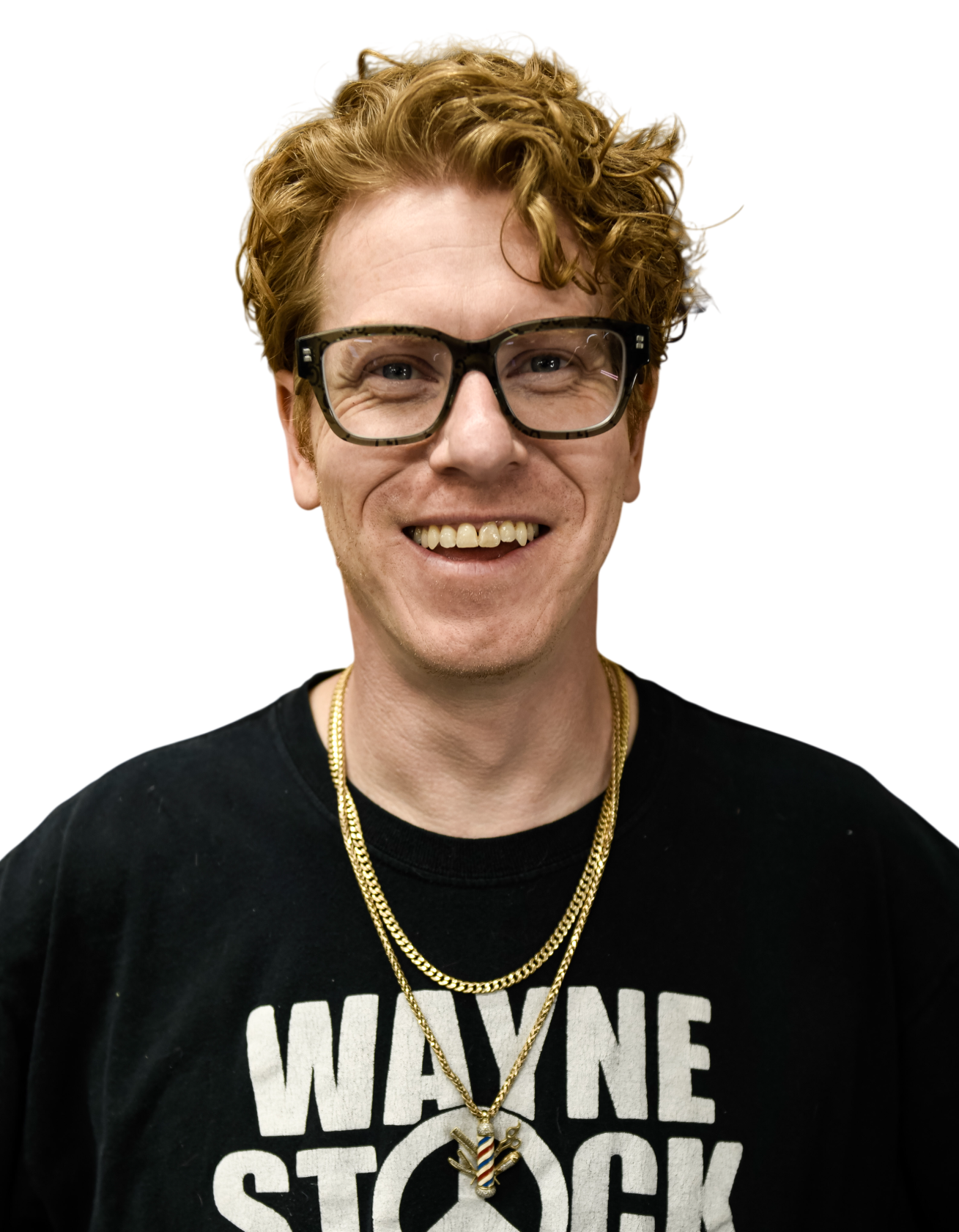 Man with red curly hair and glasses, wearing a gray t-shirt.