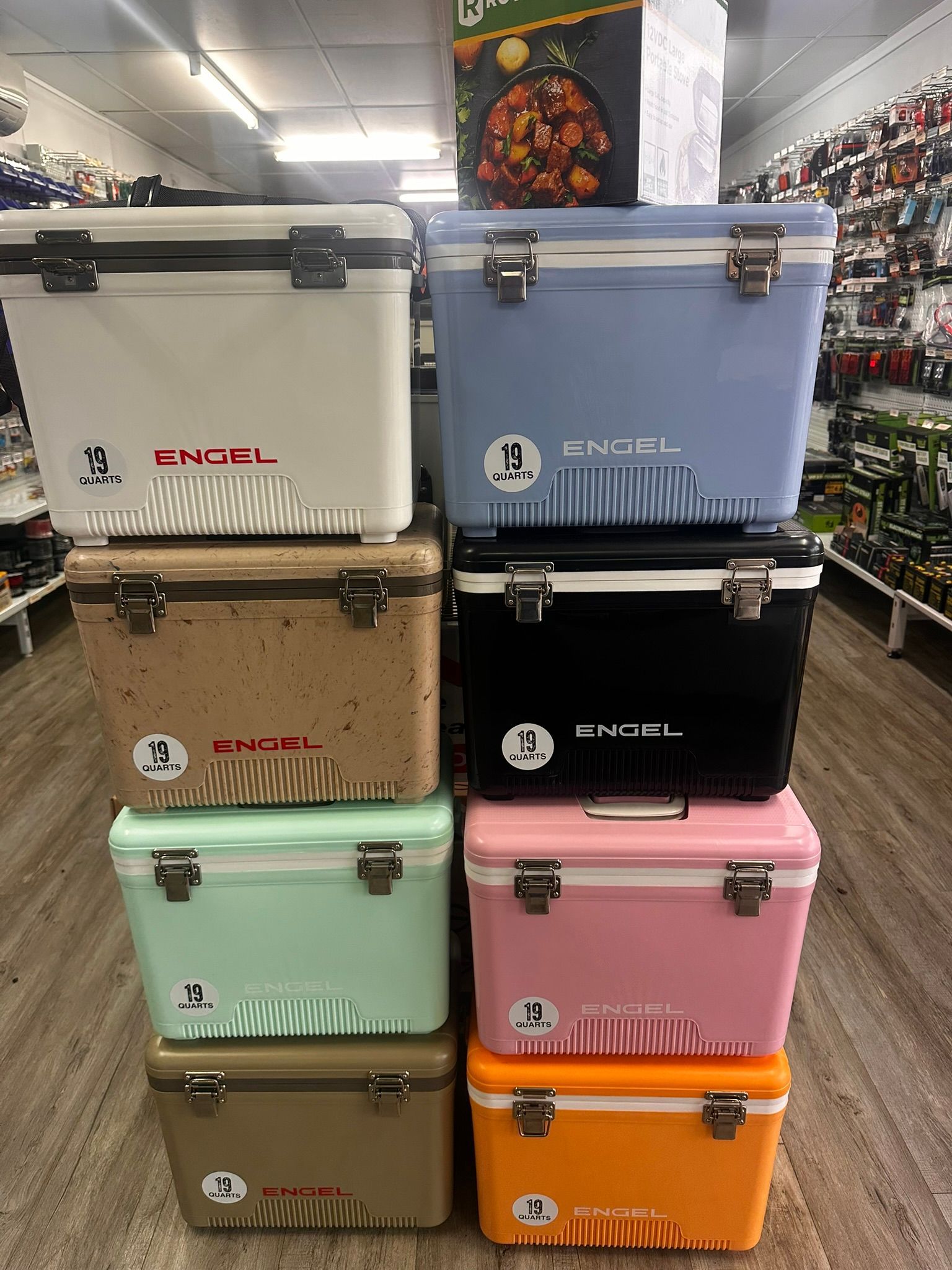 Stacked Colorful Engel Coolers Displayed in a Store Aisle — PowerMaster Batteries Moree in St, Moree, NSW