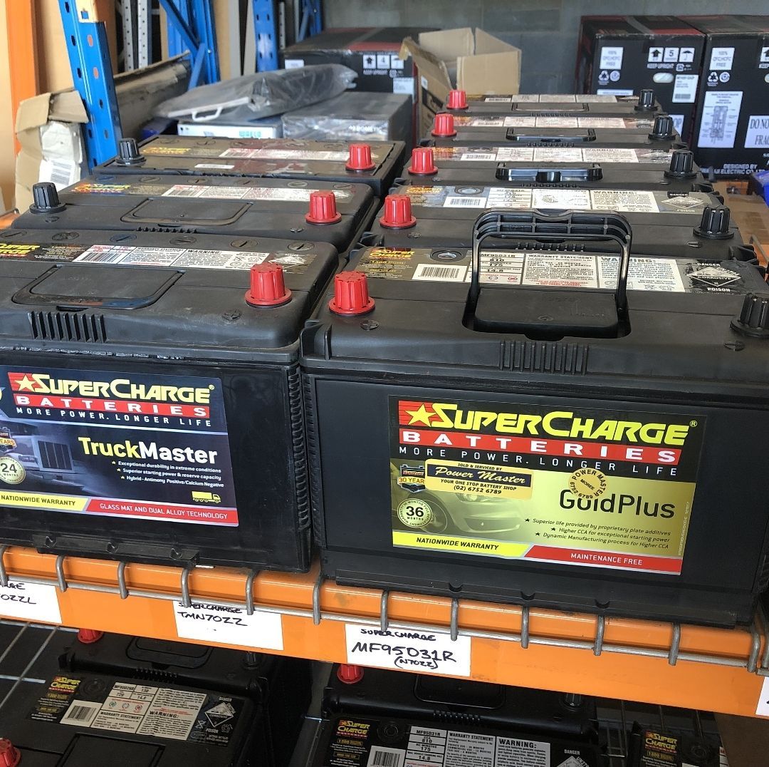 Rows of Black Supercharge Car Batteries on a Store Shelf — PowerMaster Batteries Moree in Goondiwindi, NSW