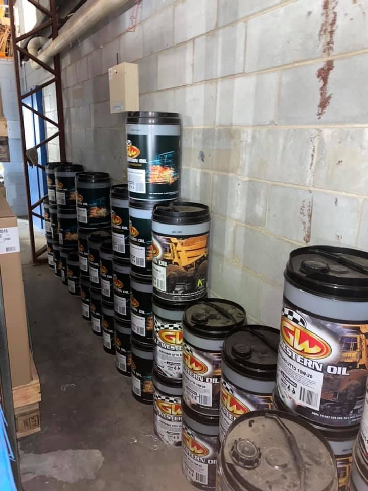 Rows of Stacked Paint Cans Lined Against a Wall — PowerMaster Batteries Moree in St, Moree, NSW