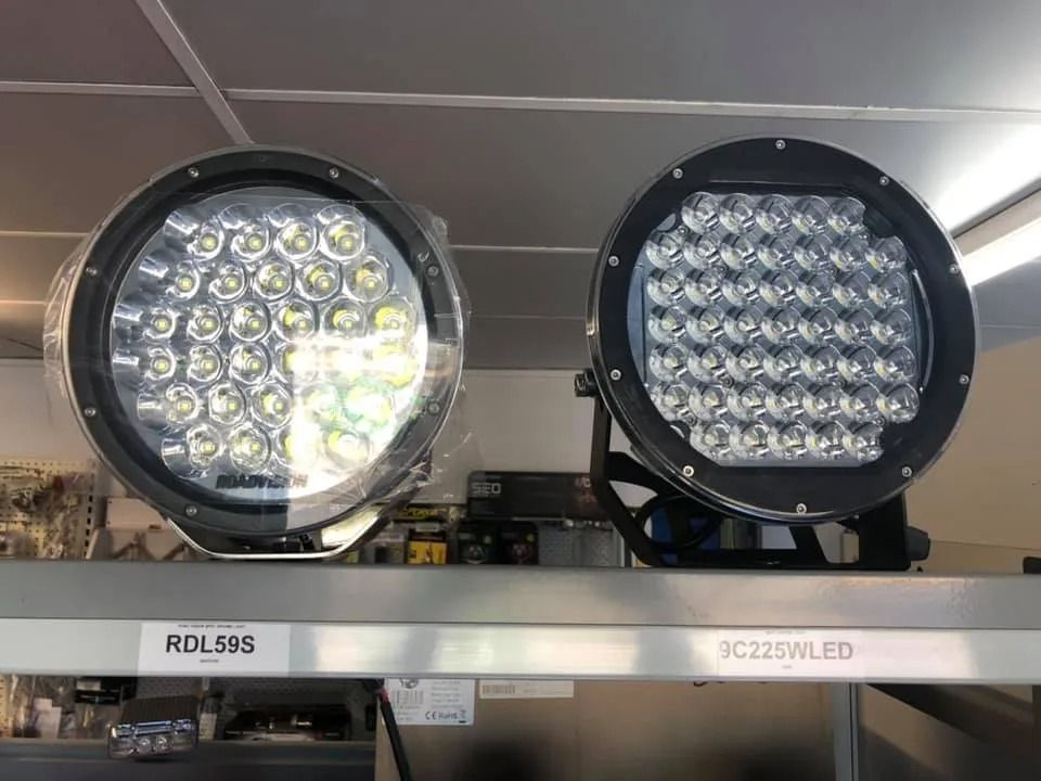Two Round LED Work Lights on a Store Shelf — PowerMaster Batteries Moree in St, Moree, NSW